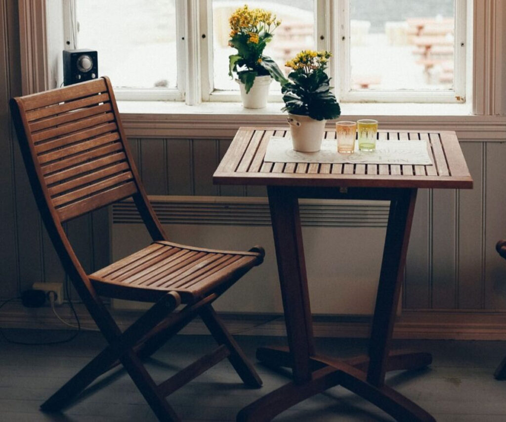 Sunlight hitting wooden furniture near a window