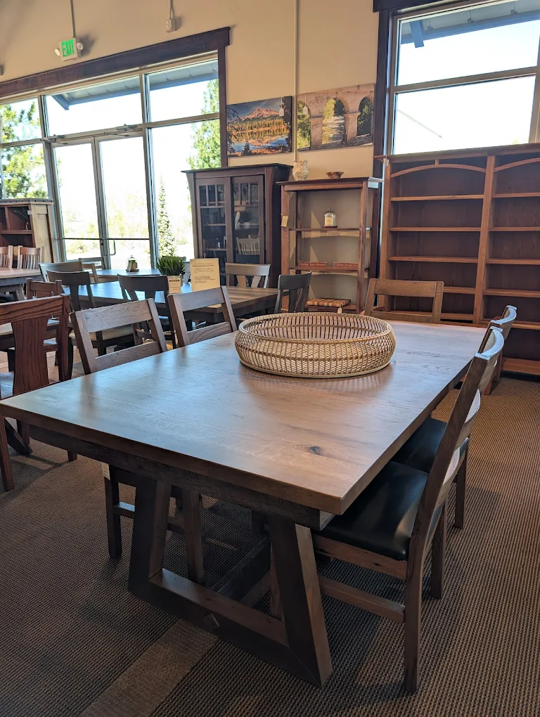 Bend showroom with solid wood dining table and bookcases